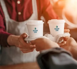Two coffee cups in a tray
